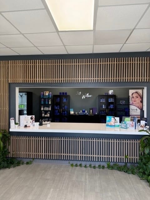 360 Wellness reception area with branded wooden slat wall in Houma, LA